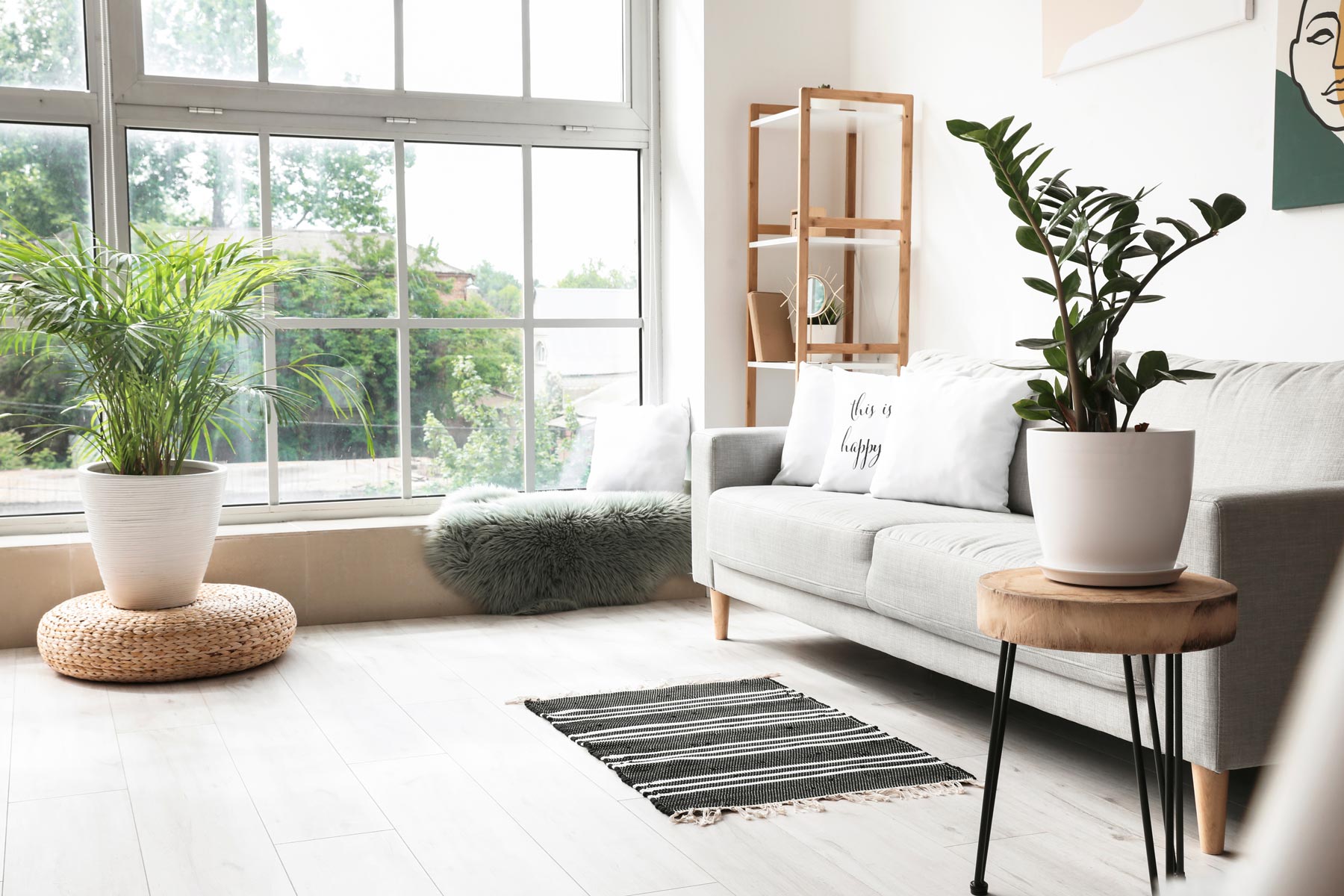 A photo of a living room with large windows